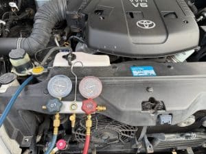 Mobile car air conditioning technician servicing a vehicle in Wellington Point