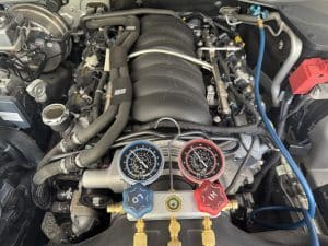 Experienced mobile car air conditioning technician servicing a vehicle in Birkdale